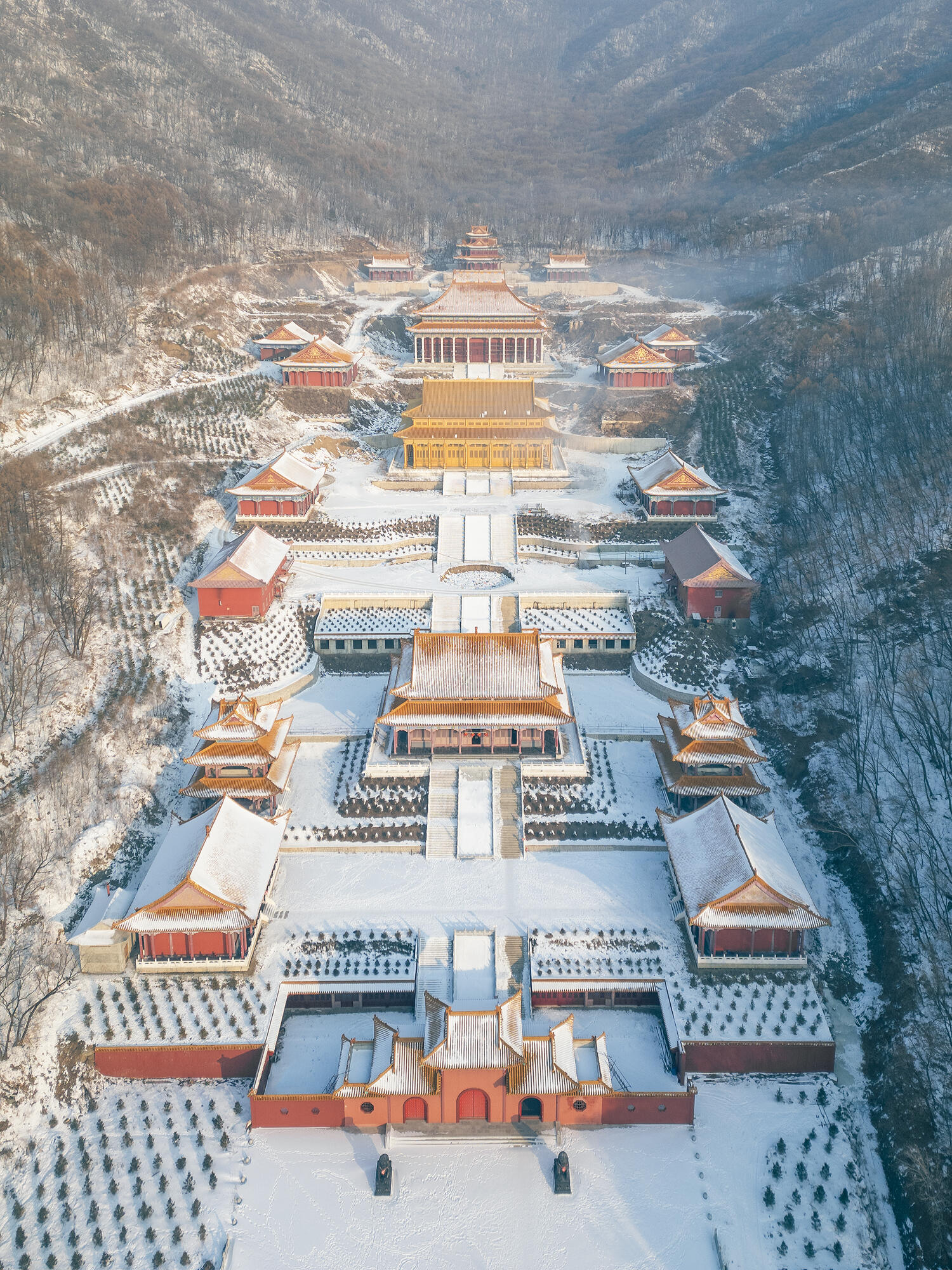 Aerial view of the snow-covered Mukden Palace in Shenyang, showcasing traditional Chinese architecture in winter.