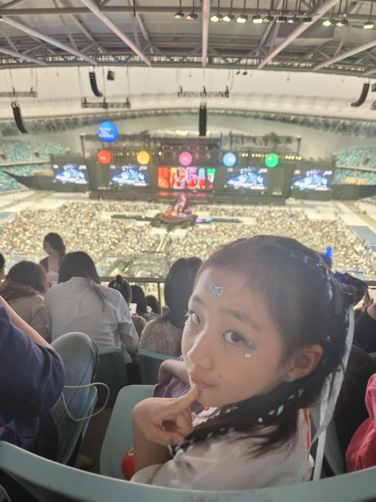 Concert-goer at Greater Bay Area Sports Center, capturing the vibrant atmosphere of the GBA Road Trip