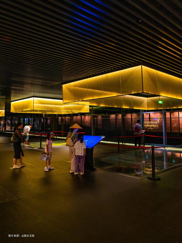 Visitors captivated by the immersive exhibits at the Chu King's Chariot and Horse Array, a highlight of this Hubei historical journey.